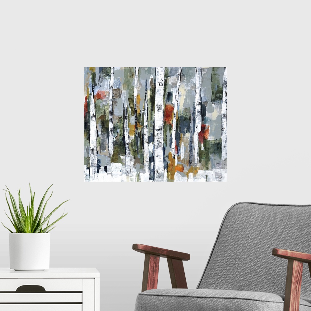 A modern room featuring Large abstract painting of a wooded forest of colorful fall leaves.