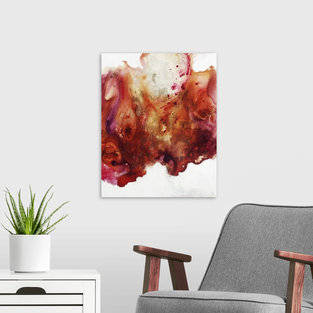 A modern room featuring Large abstract painting of vibrant colors of orange, red and pink.