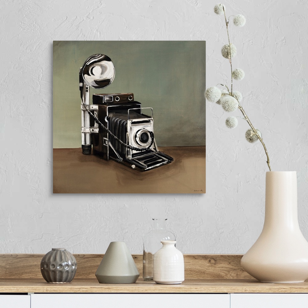 A farmhouse room featuring This is a painting of a vintage style speed graphic camera.