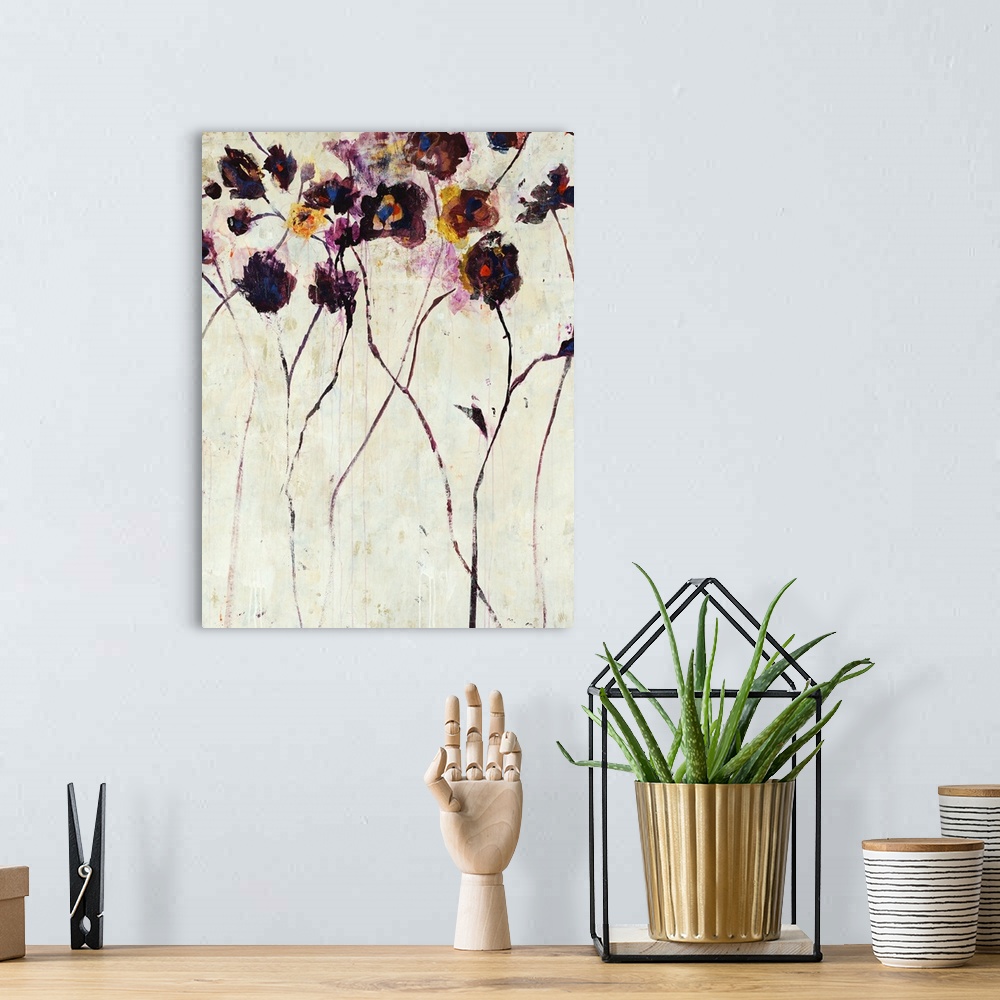 A bohemian room featuring Tall, purple violet flower painting on a bright neutral background.