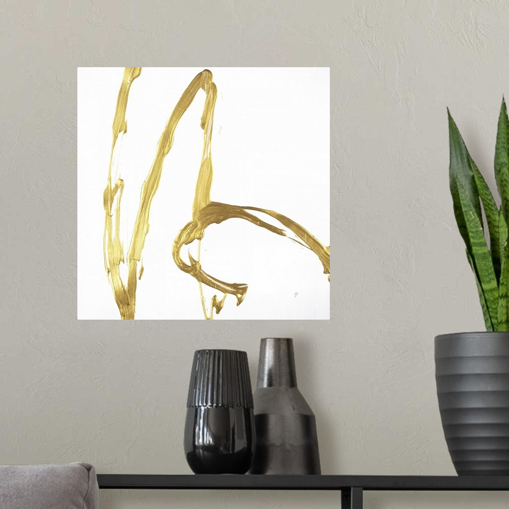 A modern room featuring Square minimalist abstract artwork with metallic gold brushstrokes on a white background.