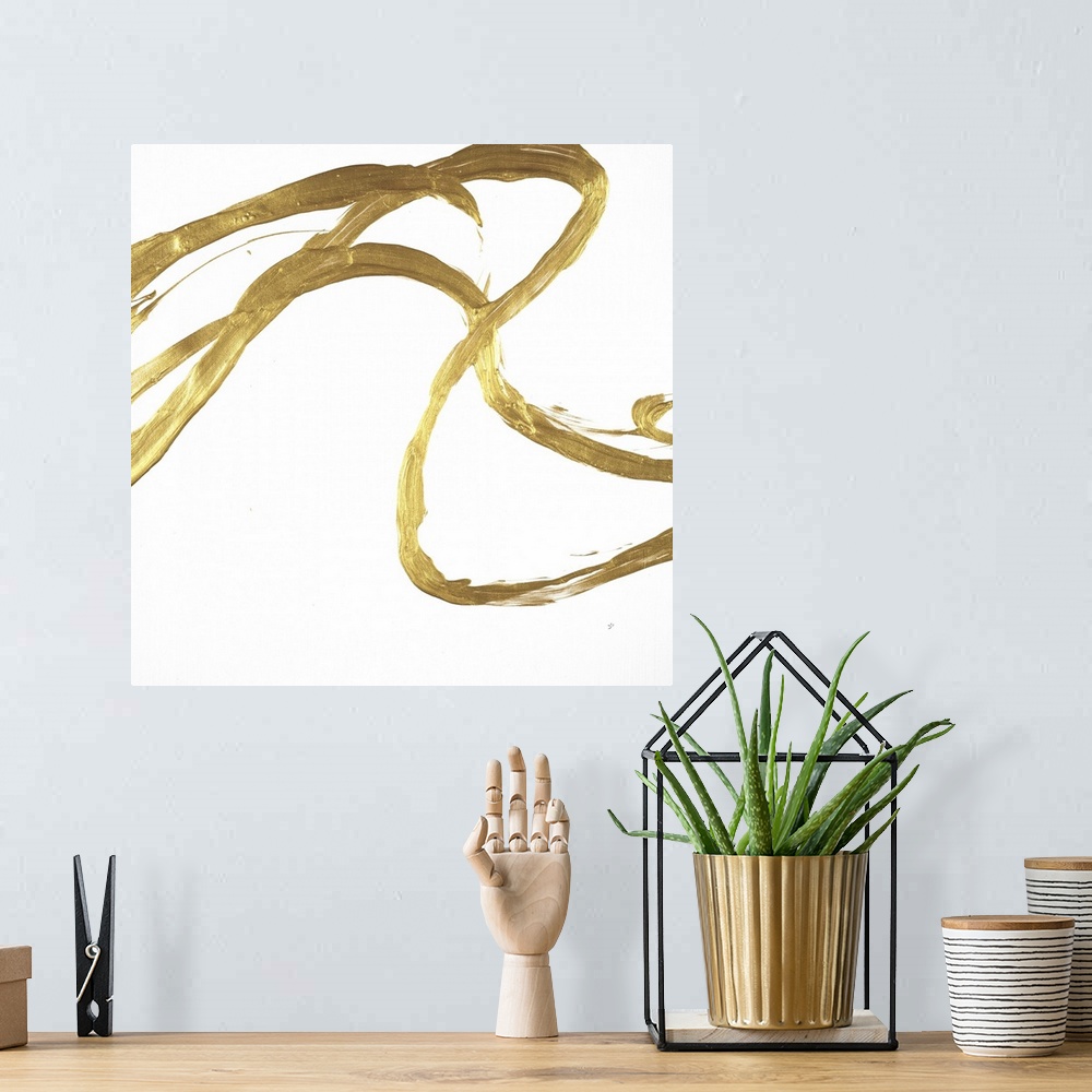 A bohemian room featuring Square minimalist abstract artwork with metallic gold brushstrokes on a white background.