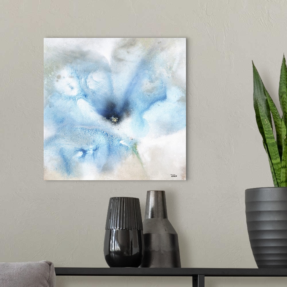 A modern room featuring Square abstract painting of a large blue flower with gray, tan, and white hues around.