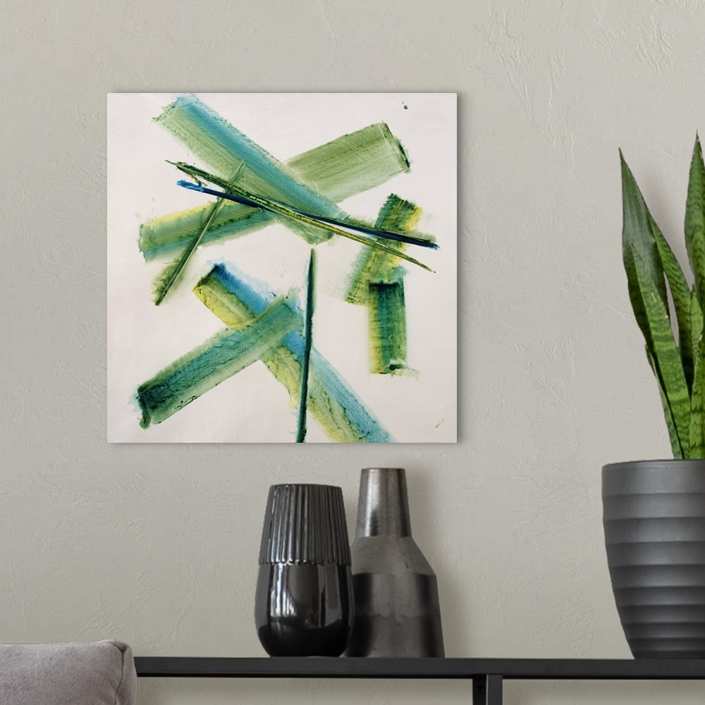 A modern room featuring An energetic blend of crossing strokes of green and blue colors in the center of the artwork.