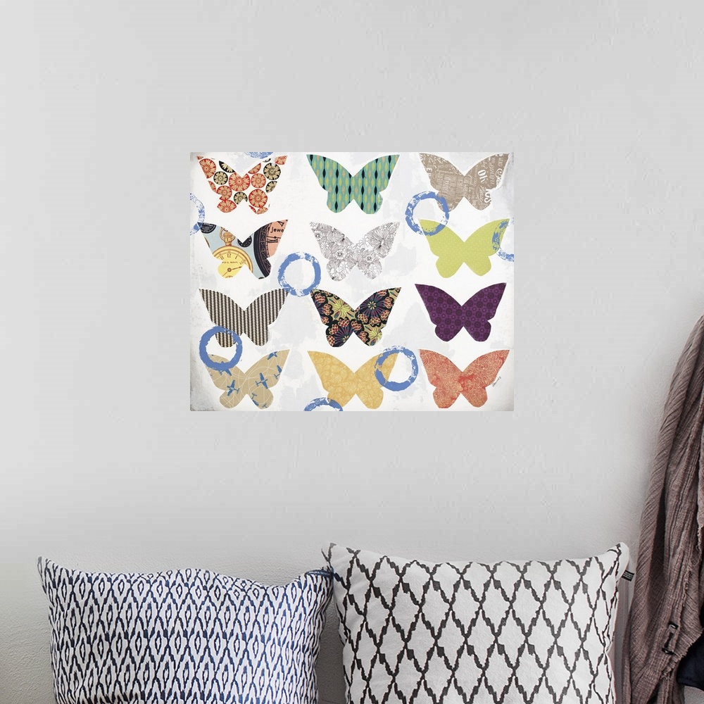 A bohemian room featuring Contemporary mixed media artwork with colorful, patterned butterflies pasted onto a white and gra...
