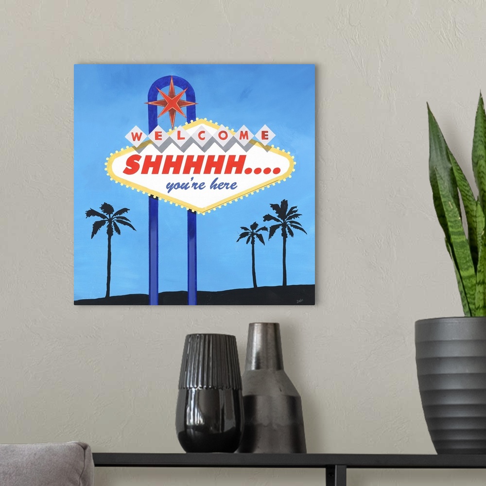 A modern room featuring Painting of the famous Las Vegas welcome sign, rewritten to read "Shhh... you're here."