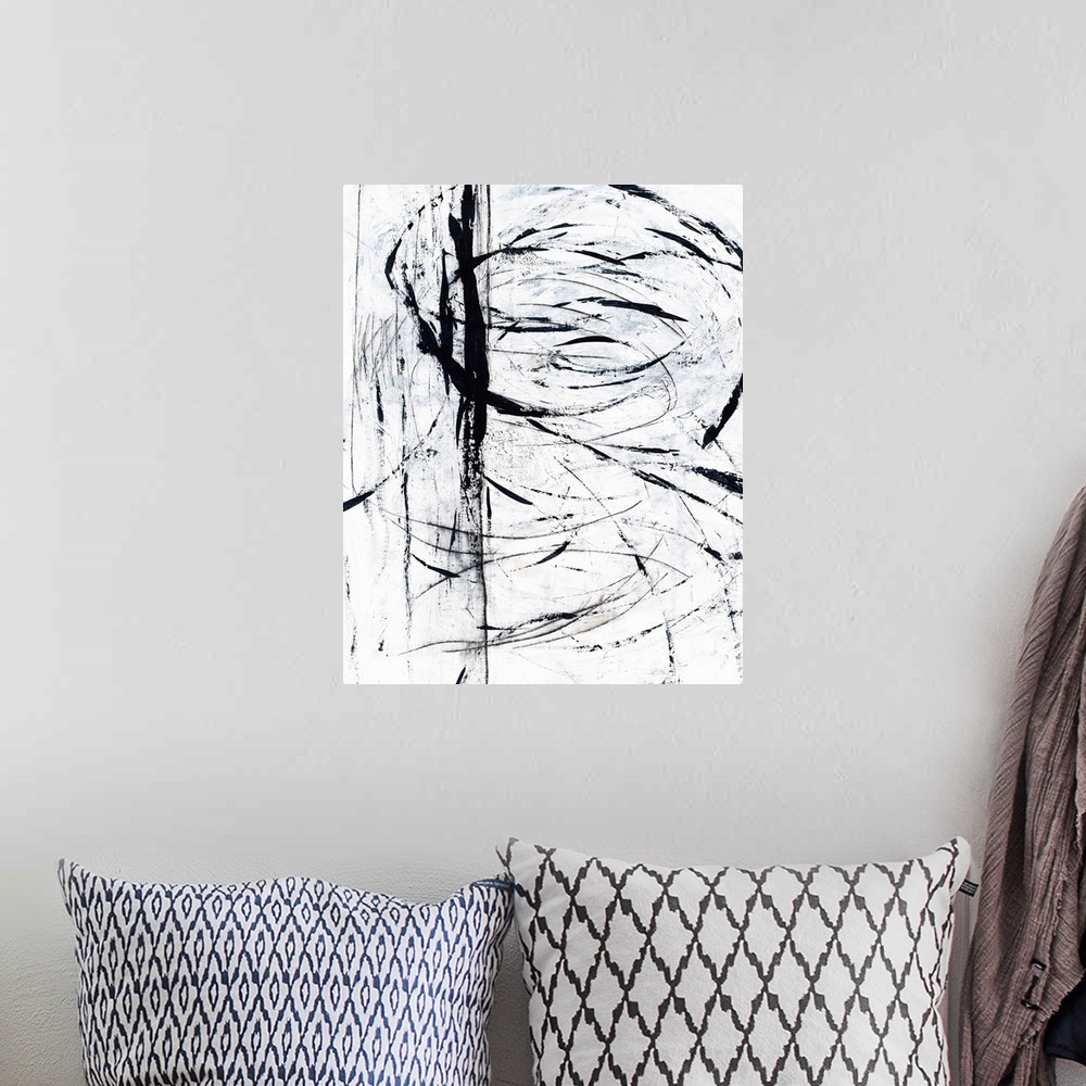 A bohemian room featuring Contemporary abstract painting using bold black lines against a white surface.