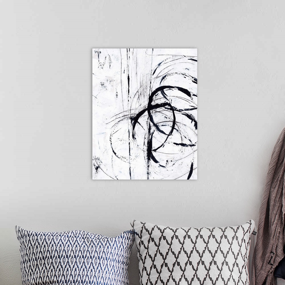 A bohemian room featuring Contemporary abstract painting using bold black lines against a white surface.