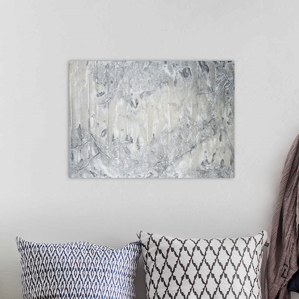 A bohemian room featuring A contemporary abstract painting using neutral tones in textural forms.