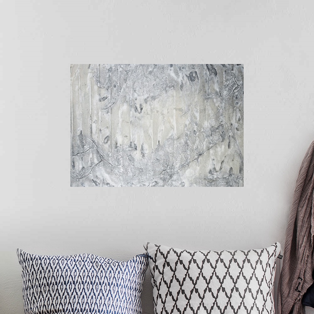 A bohemian room featuring A contemporary abstract painting using neutral tones in textural forms.