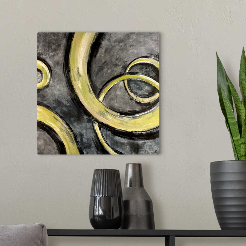 A modern room featuring Square contemporary painting of yellow swirls moving along a textured gray background, evoking a ...
