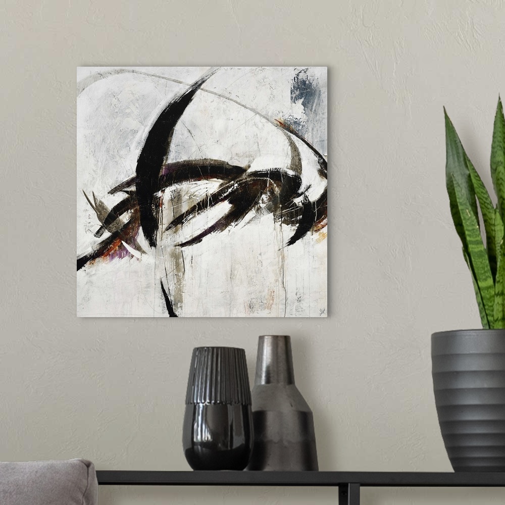A modern room featuring Abstract painting using harsh black paint strokes against a neutral background.
