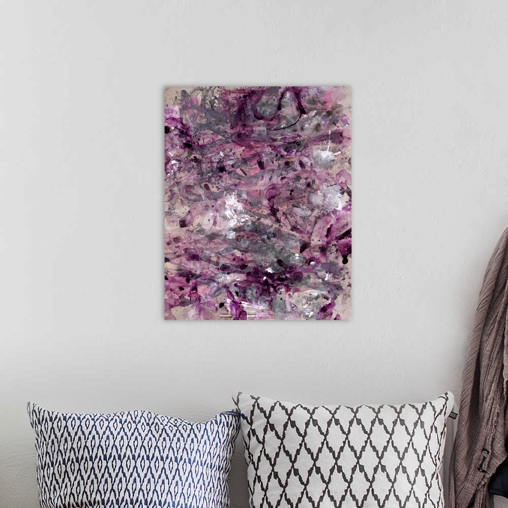 A bohemian room featuring Contemporary abstract painting consisting of pink, purple, and black paint splatter design on a b...