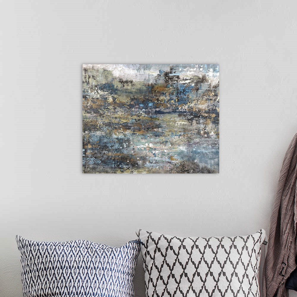 A bohemian room featuring Rough textured abstract art with shades of blue, brown, gold, and white.