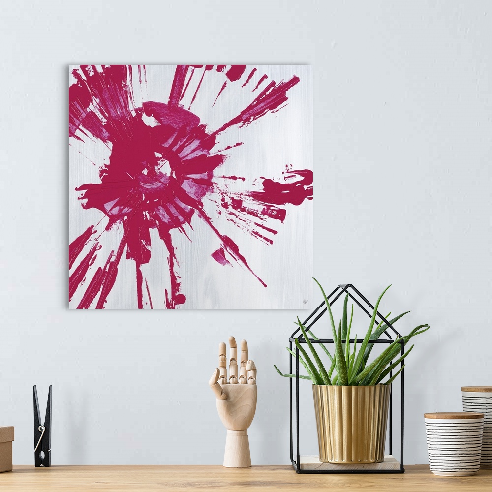 A bohemian room featuring Square abstract painting with a pink circular splatter design on a gray background.