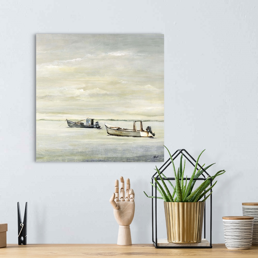 A bohemian room featuring Painting of two small fishing boats sitting in calm water beneath a cloudy grey sky.