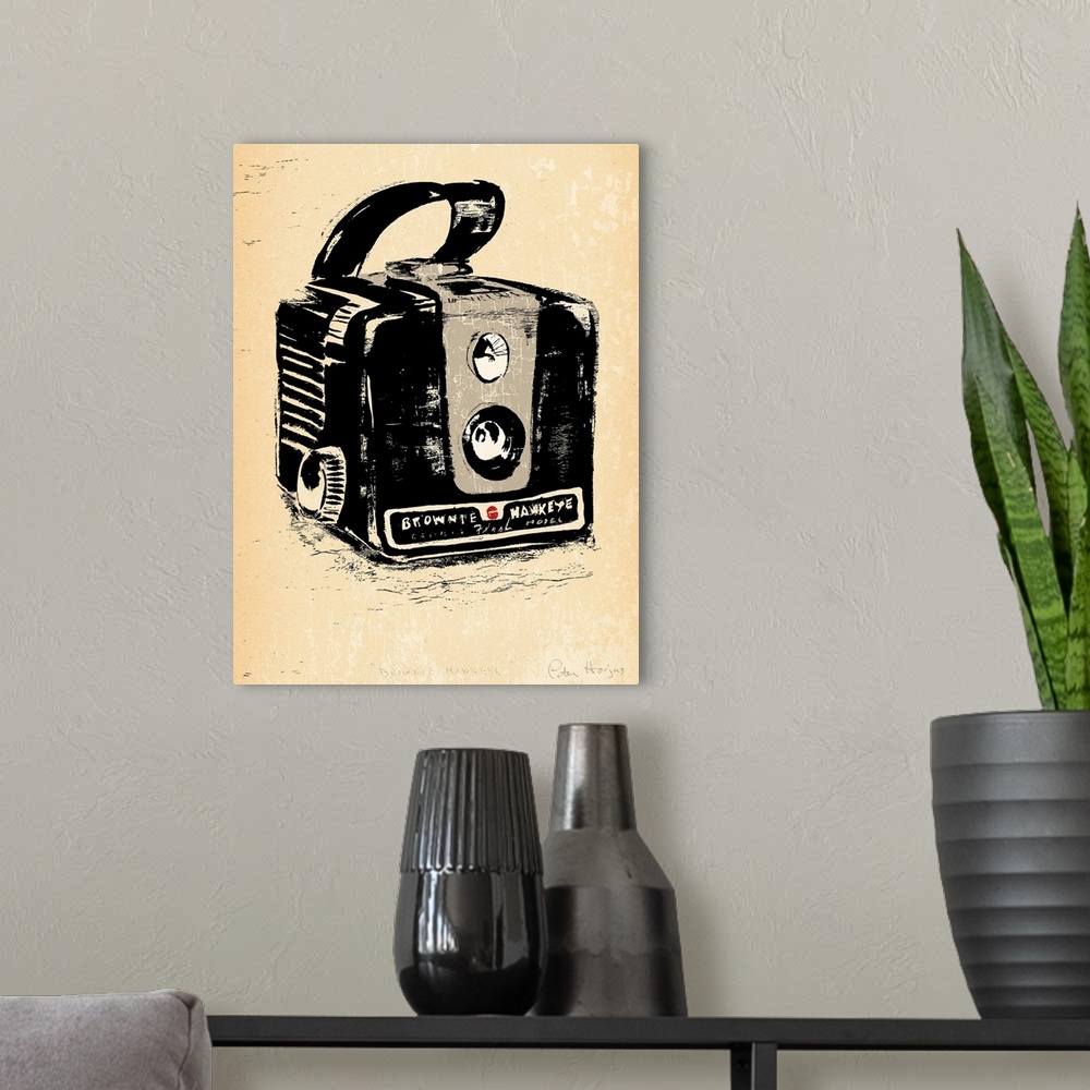 A modern room featuring 1940's vintage style wall art of a kodak brownie camera illustrated in black ink wash on distress...