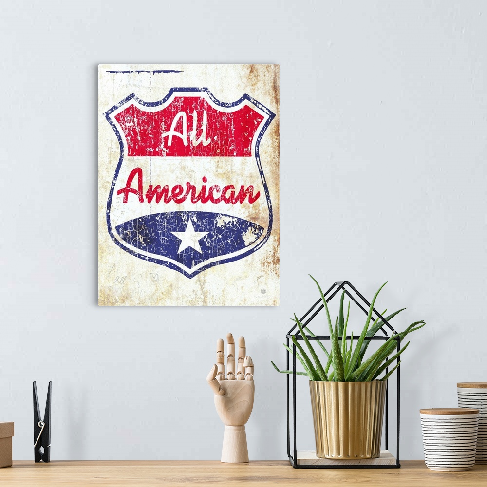 A bohemian room featuring A red, white and blue crest or shield with the words All American on an old aged, distressed, and...