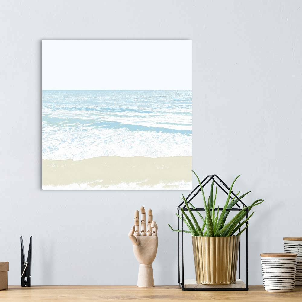 A bohemian room featuring A simple graphic of a peaceful ocean beach with small waves and gleaming sand in the foreground.