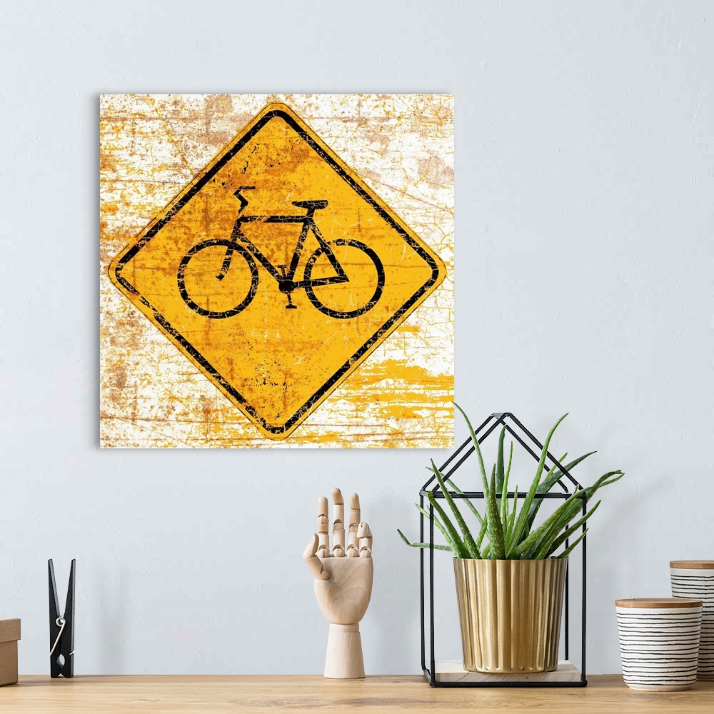 A bohemian room featuring A worn, distressed, cracked and rusty Bike street sign.