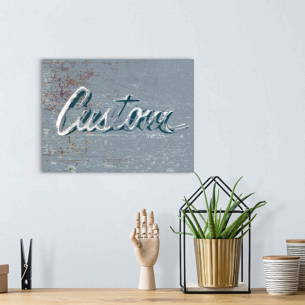 A bohemian room featuring Graphic rusty wall art of distressed typography with the the word Custom large and in center on a...