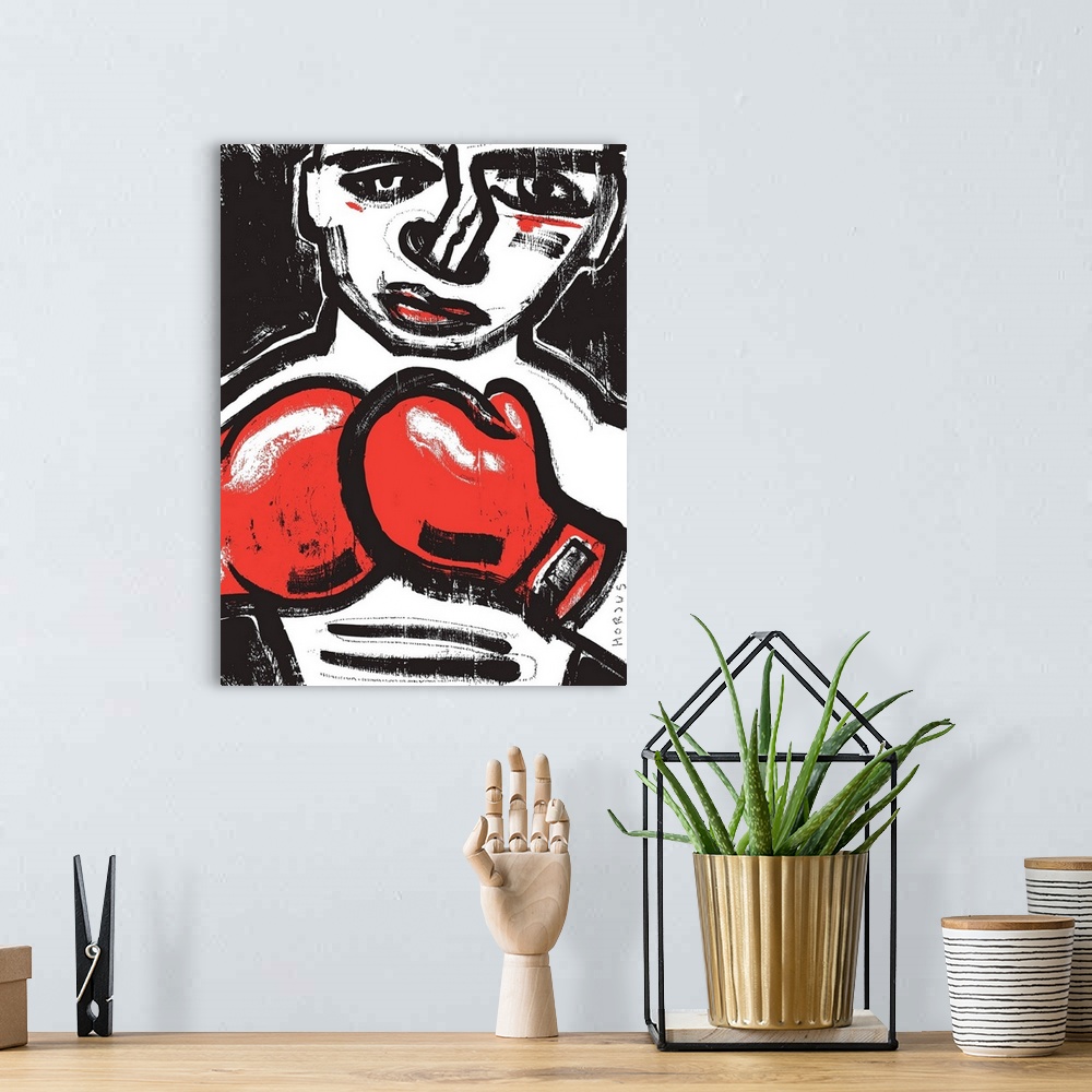 A bohemian room featuring Black and white painting of a fighting boxer with red boxing gloves.