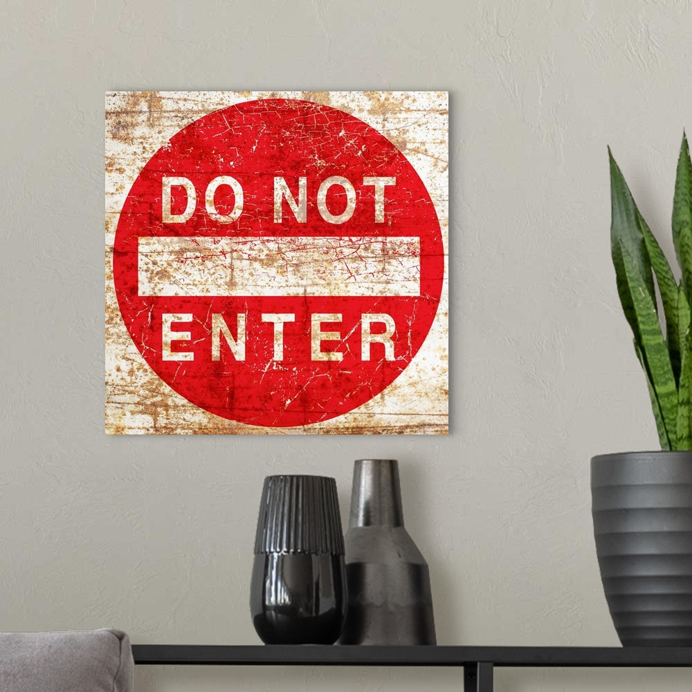 A modern room featuring A worn, distressed, cracked and rusty Do Not Enter street sign.