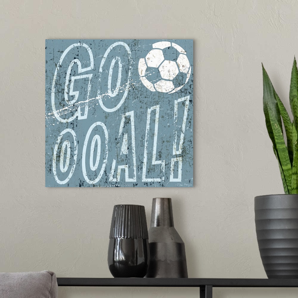 A modern room featuring Soccer scoring goal expression "Goooooal" with soccer ball in the typography.