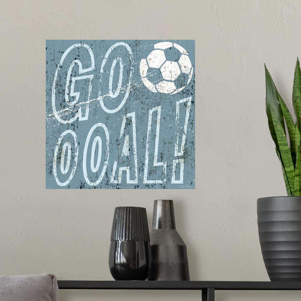 A modern room featuring Soccer scoring goal expression "Goooooal" with soccer ball in the typography.