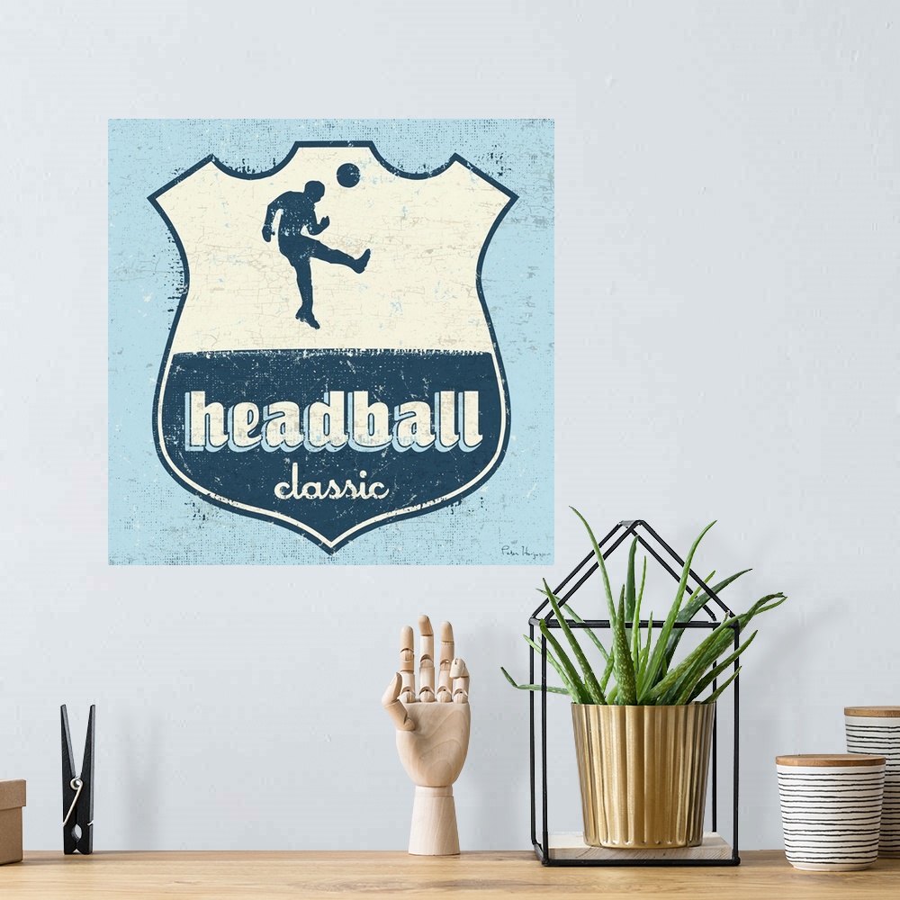 A bohemian room featuring Distressed  soccer logo of soccer player head-balling a soccer ball with the words Headball Classic.