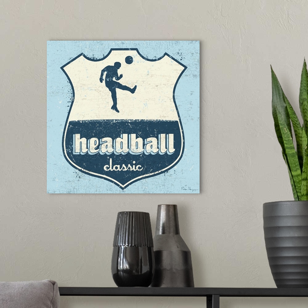 A modern room featuring Distressed  soccer logo of soccer player head-balling a soccer ball with the words Headball Classic.