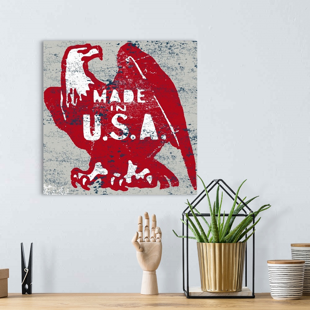A bohemian room featuring Distressed image of a red American eagle with "Made in the USA" typography on a white and rust ba...