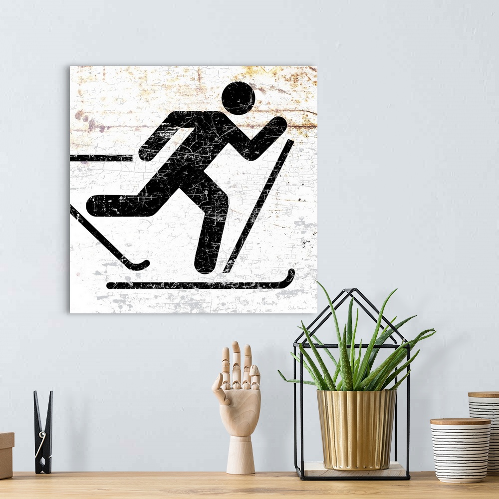 A bohemian room featuring A worn, distressed, cracked and rusty cross country skier sign.