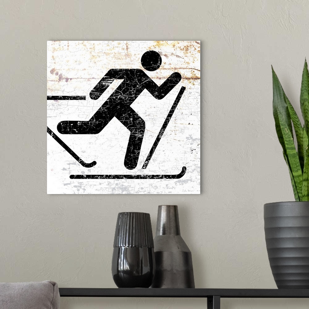 A modern room featuring A worn, distressed, cracked and rusty cross country skier sign.