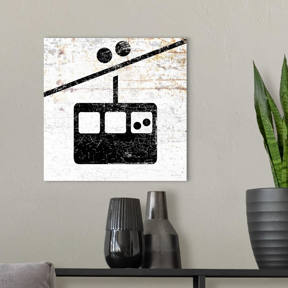 A modern room featuring A worn, distressed, cracked and rusty gondola ski lift sign.