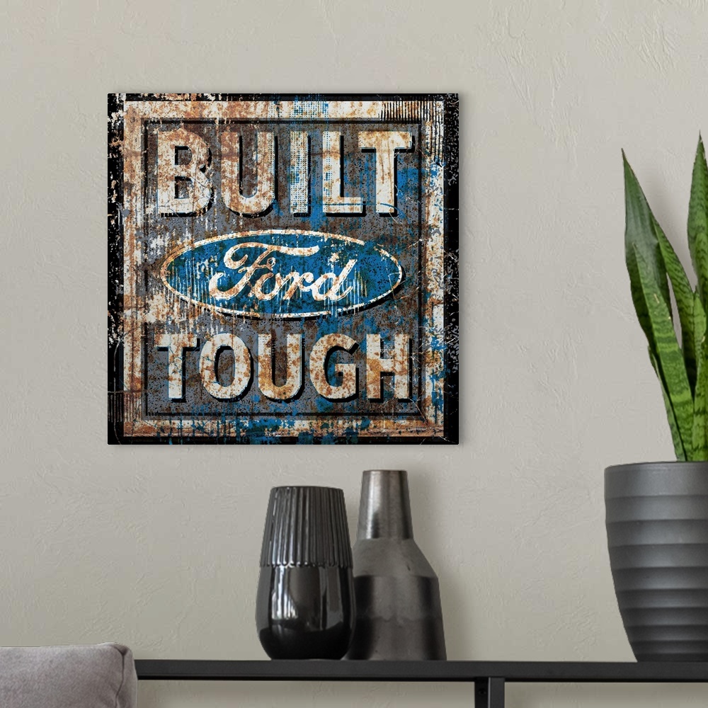 A modern room featuring A worn, distressed, cracked and rusty Ford Genuine Parts sign.