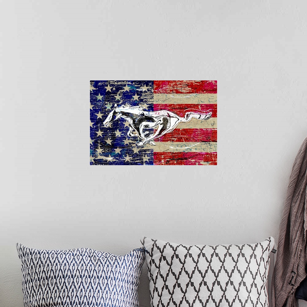 A bohemian room featuring A worn, distressed, cracked and rusty Ford running horse logo graphic with the American Flag supe...