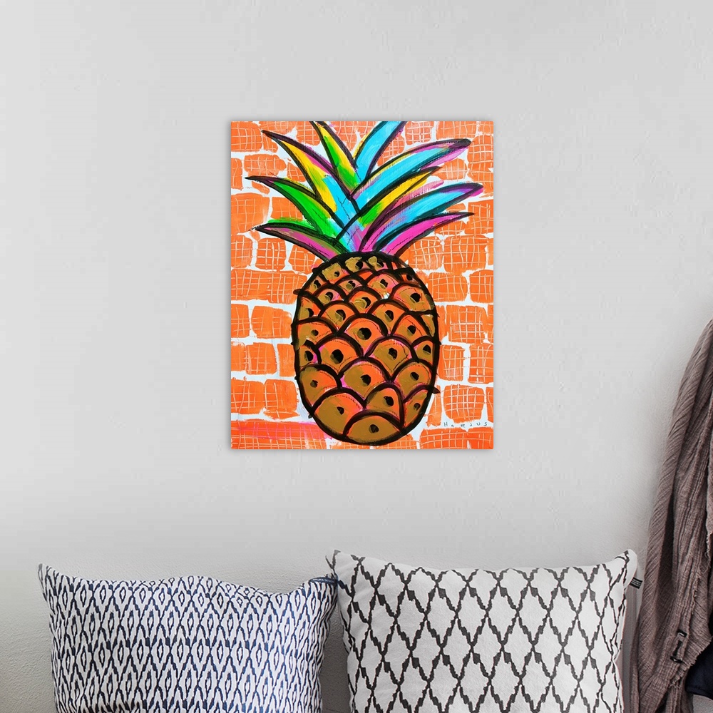 A bohemian room featuring Pineapple painted gold and black with a rainbow burst of colors on the leaves on an orange backgr...