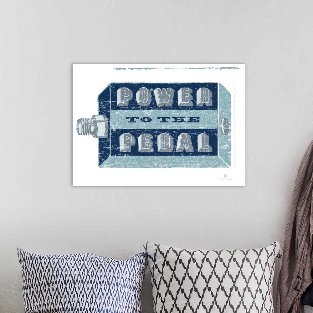 A bohemian room featuring A graphic image of a bike pedal with the words Power to the Pedal on the pedal.