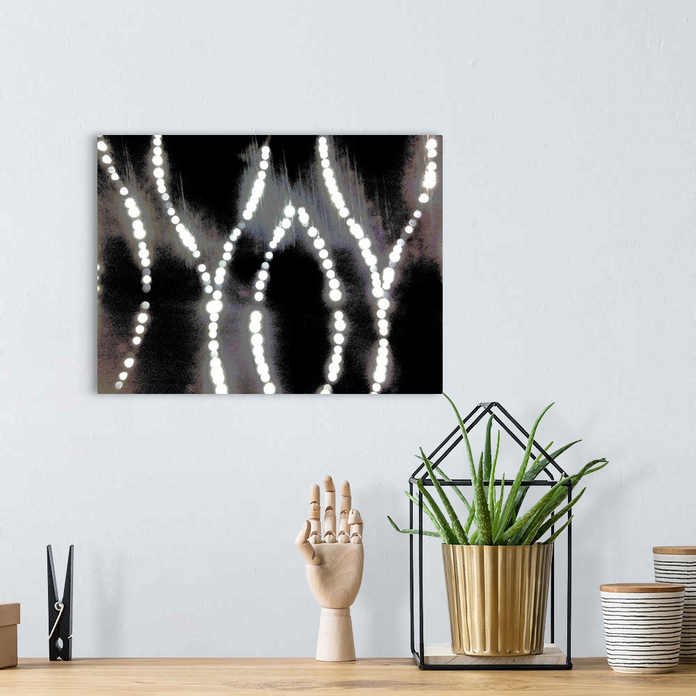 A bohemian room featuring An abstract of curved bright diamond dot lights on a silver, gold and black background.