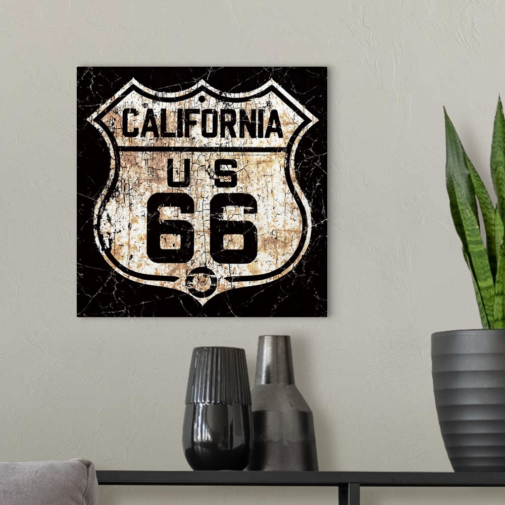 A modern room featuring A back and white, worn, distressed and rusty vintage Route 66 street sign.