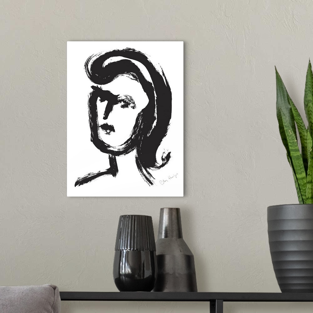 A modern room featuring A quick black brush illustration of a young woman's face.