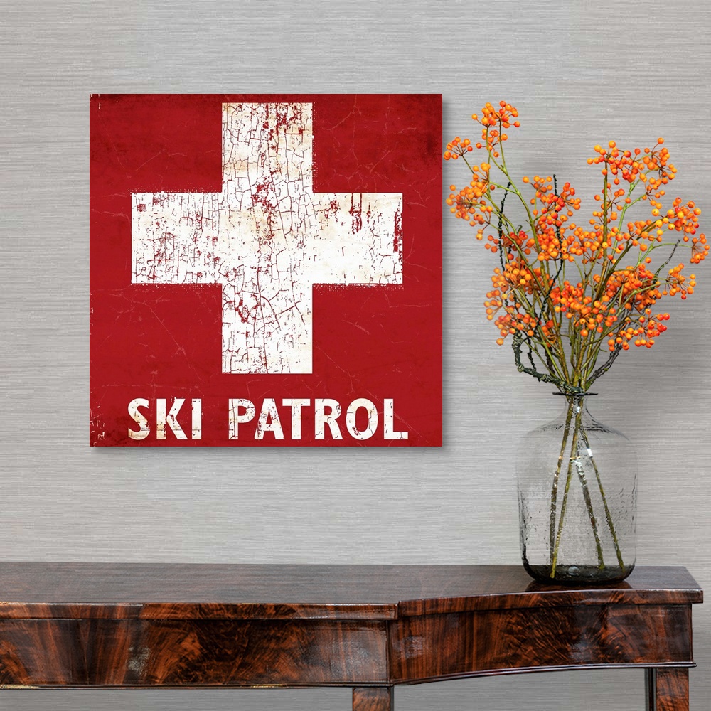 A traditional room featuring A worn, distressed, cracked and rusty Ski Patrol ski sign.