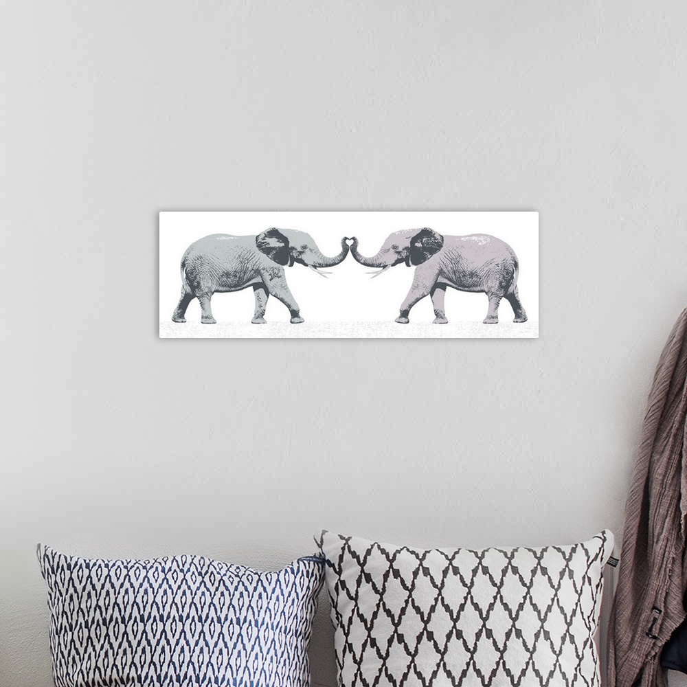 A bohemian room featuring Graphic art of two elephants with trunks touching forming the shape of a love heart.