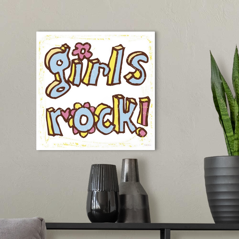 A modern room featuring The words "Girls Rock" handwritten in pen and ink.