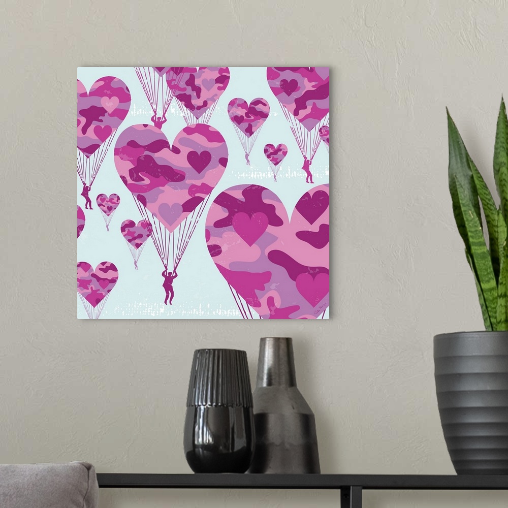 A modern room featuring Graphic art of paratroopers with pink camoflauge parachutes in the shape of hearts.