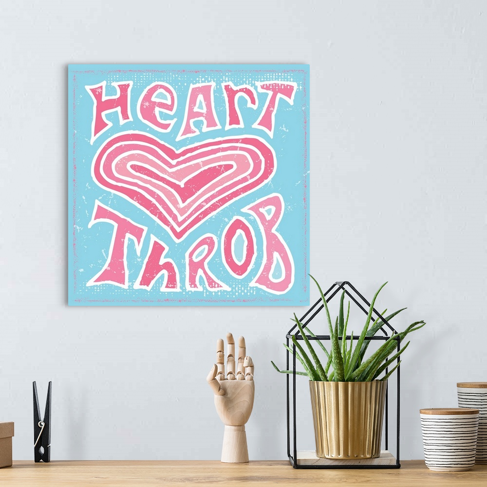 A bohemian room featuring Hand lettered phrase "Heart Throb" around an image of a heart on a light blue background.