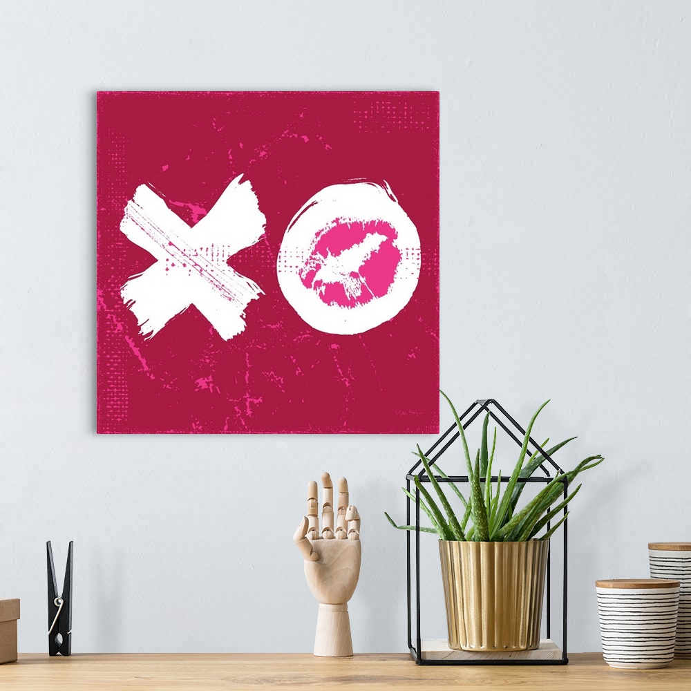 A bohemian room featuring A large illustrated X and O signifying a big kiss and a hug.