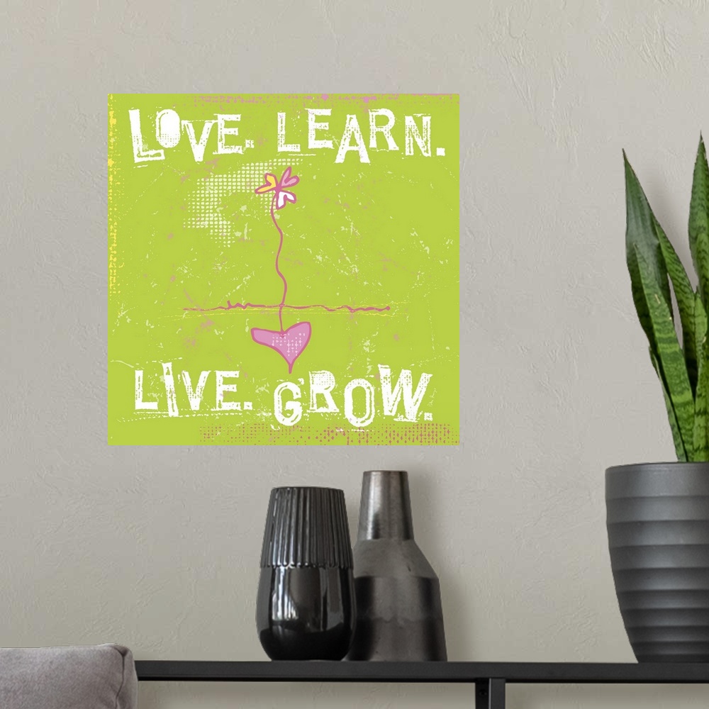 A modern room featuring Typography words Love. Learn. Live. Grow. arranged around a daisy with a heart as the root.