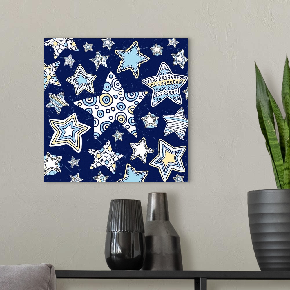 A modern room featuring A group of pen and ink illustrated stars, from large to small stars on a midnight blue background.